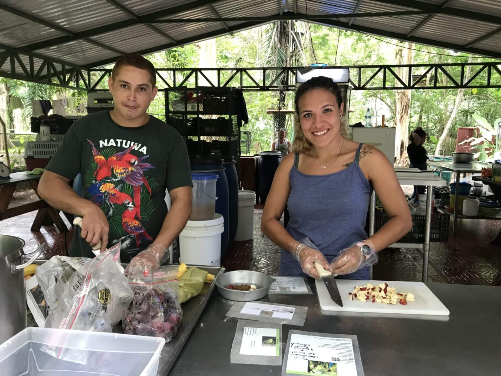 Volunteers feeding animals in NATUWA